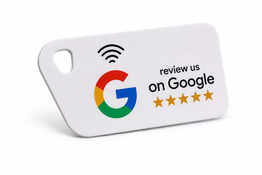 White tap-to-review key fob with the Google logo and five stars.