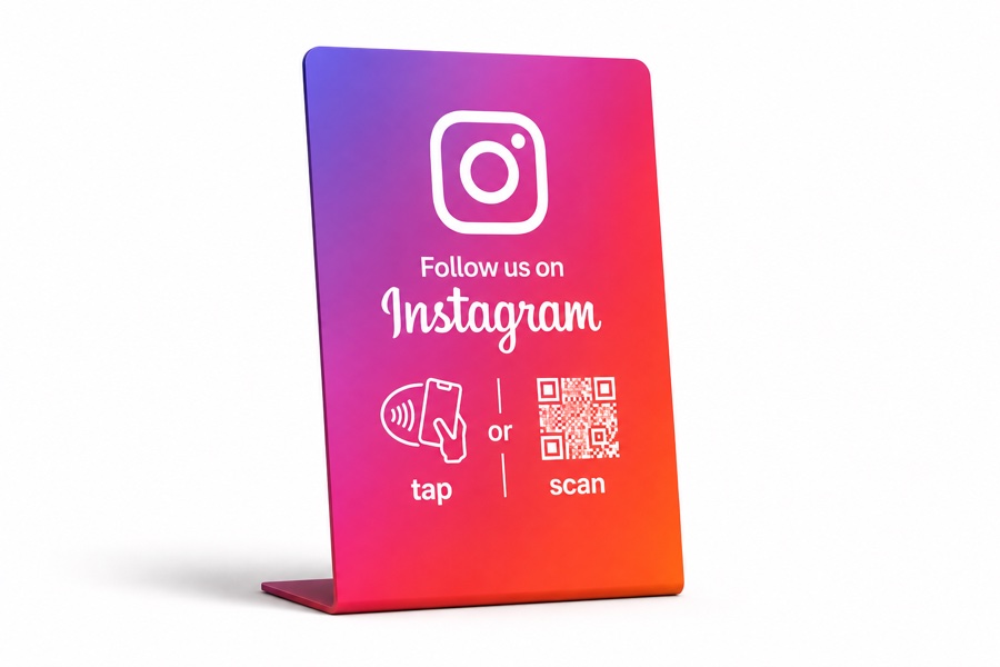 Freestanding gradient countertop stand inviting customers to follow on Instagram, with tap and scan icons.