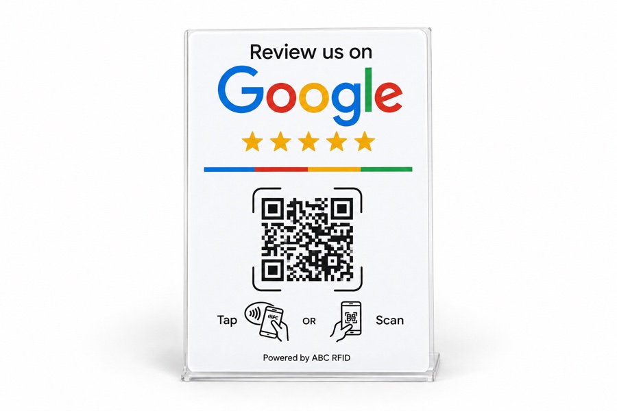 Freestanding white acrylic countertop review stand with a QR code and tap or scan icons.
